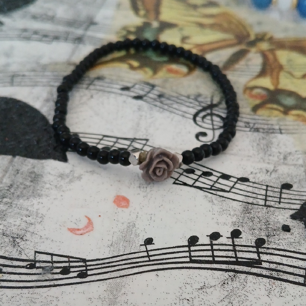 Elegant Black Beaded Bracelet with Rose Accent